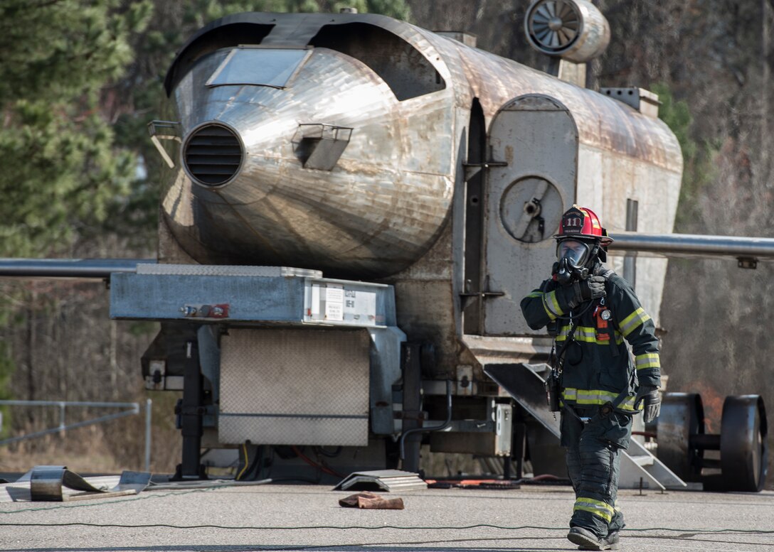 A Hampton Division of Fire and Rescue firefighter prepares for an aircraft crash exercise in Hampton, Va., March 10, 2016. The exercise combined support from the Hampton Fire and Police divisions, Thomas Nelson Community College, Sentara Healthcare Center and units from Langley Air Force Base. (U.S. Air Force photo by Airman 1st Class Derek Seifert)