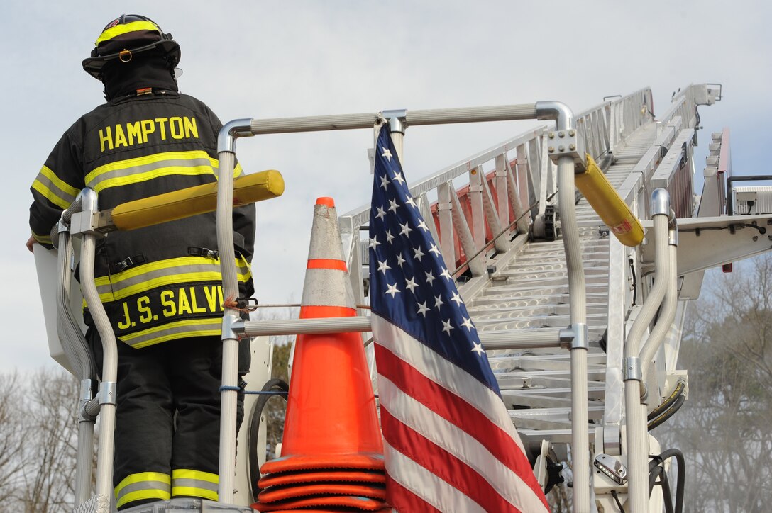 Hampton Division of Fire and Rescue firefighters participate in a joint exercise in Hampton, Va., March 10, 2016. The purpose of the exercise was for local organizations to simulate a scenario to evaluate plans and procedures, as well as to point out discrepancies, in order to better prepare for possible real-world events. (U.S. Air Force photo by Senior Airman Brittany E. N. Murphy)