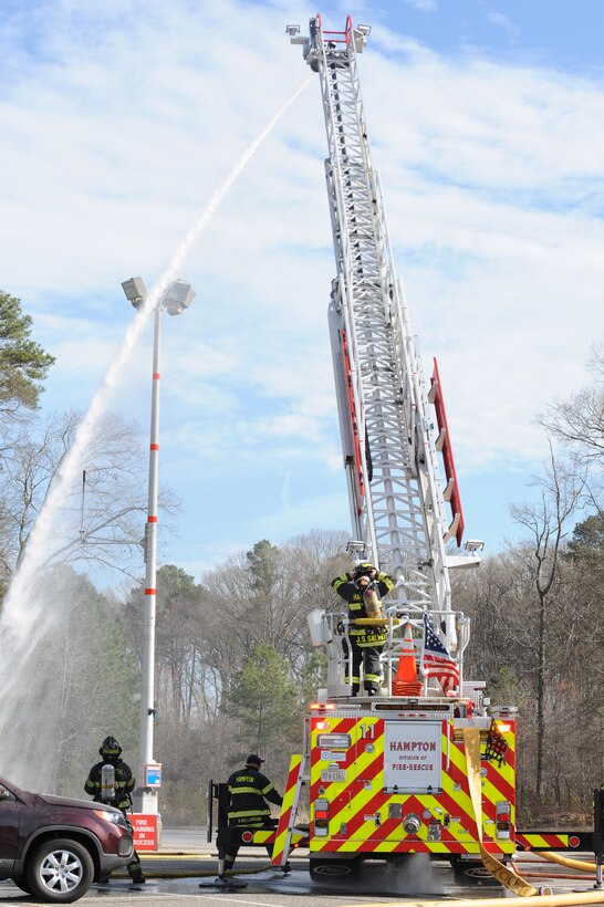 Hampton Division of Fire and Rescue firefighters participate in a joint exercise in Hampton, Va., March 10, 2016. Organizations from the local community joined in the exercise, including the 633rd Air Base Wing, 1st and 192nd Fighter Wings, Sentara Healthcare Center and Hampton Police Division. (U.S. Air Force photo by Senior Airman Brittany E. N. Murphy)