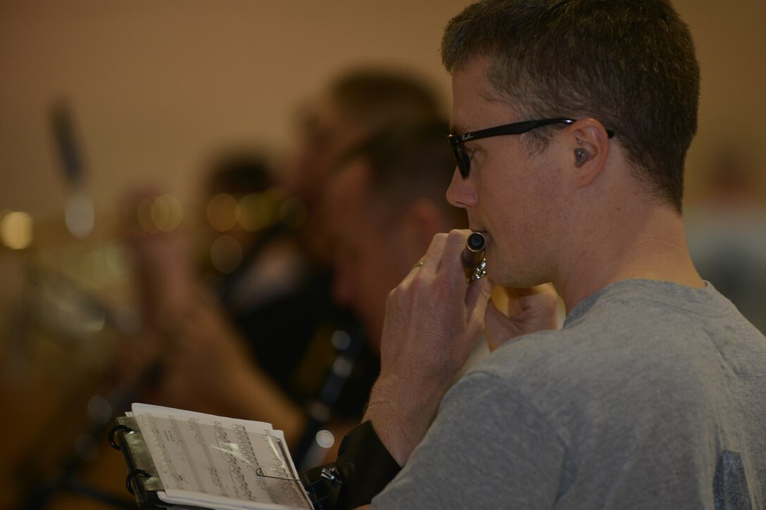 U.S. Army Spc. Ryan MacDonald, instrumentalist with the U.S. Army Training and Doctrine Command band, plays the flute during practice at Fort Eustis, Va., March 10, 2016. The band was holding rehearsal for the Virginia International Tattoo, which takes place at the Norfolk Scope arena April 21-24, 2016. (U.S. Air Force photo by Staff Sgt. Natasha Stannard)

