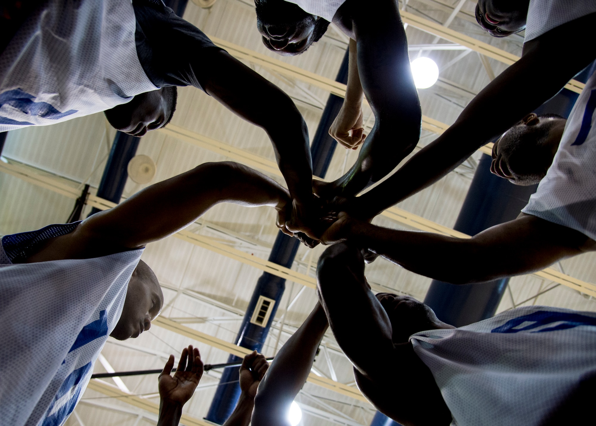 The Langley All-Stars huddle before the second half of the Joint Base Langley-Eustis all-star basketball game at Langley Air Force Base, Va., March 9, 2016. The Langley All-Stars trailed the Eustis All-Stars 28-35 at halftime and ultimately lost 64-53. (U.S. Air Force photo by Staff Sgt. J.D. Strong II) 