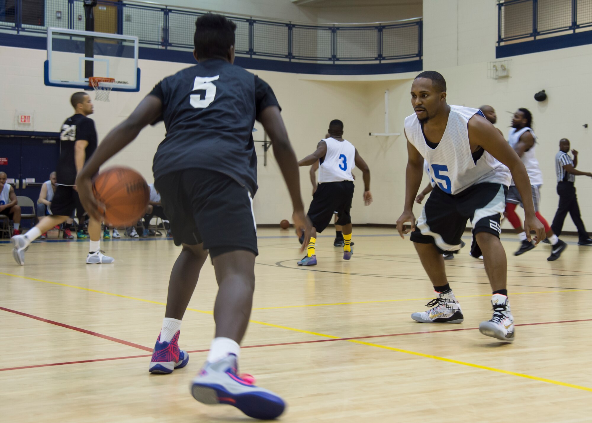 Tony Friend, point guard for the Eustis All-Stars, performs a cross-over on Langley All-Stars guard, Emanuel Stuppard, during the Joint Base Langley-Eustis all-star basketball game at Langley Air Force Base, Va., March 9, 2016. Friend used his speed to start fast-breaks and penetrate the Langley All-Stars’ defense leading to his team’s 64-53 win. (U.S. Air Force photo by Staff Sgt. J.D. Strong II) 