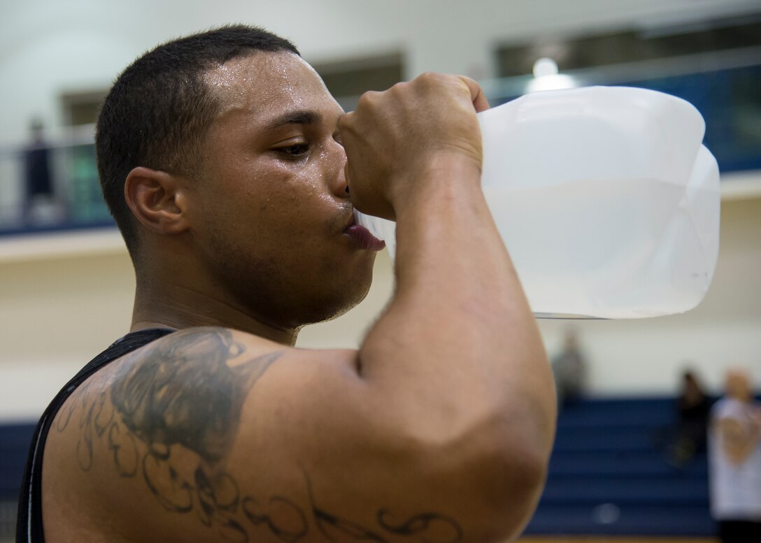 Jerome Becks, forward for the Fort Eustis All-Stars, hydrates during the Joint Base Langley-Eustis all-star basketball game at Langley Air Force Base, Va., Mar. 9, 2016. Becks finished the game with 11 points, leading the Fort Eustis team in total points scored. (U.S. Air Force photo by Staff Sgt. J.D. Strong II)