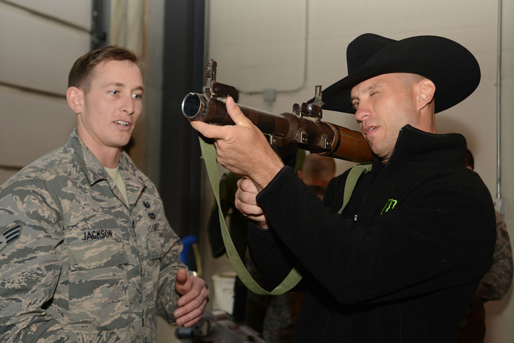 Ultimate Fighting Champion fighter Donald ‘Cowboy’ Cerrone holds an unloaded RPG during the USO Fire Station luncheon as part of the USO Spring 2016 Entertainment Tour starting at Joint Base Elmendorf-Richardson, Alaska, March 12, 2016. Air Force Gen. Paul Selva, 10th Vice Chairman of the Joint Chiefs of Staff, led the tour also featuring Miss America Betty Cantrell, country singer and 10-year Army veteran Craig Morgan, Carolina Panthers football player Charles Tillman, and Ultimate Fighting Championship fighter Anthony Pettis. (U.S. Air Force photo by Airman 1st Class Christopher R. Morales)