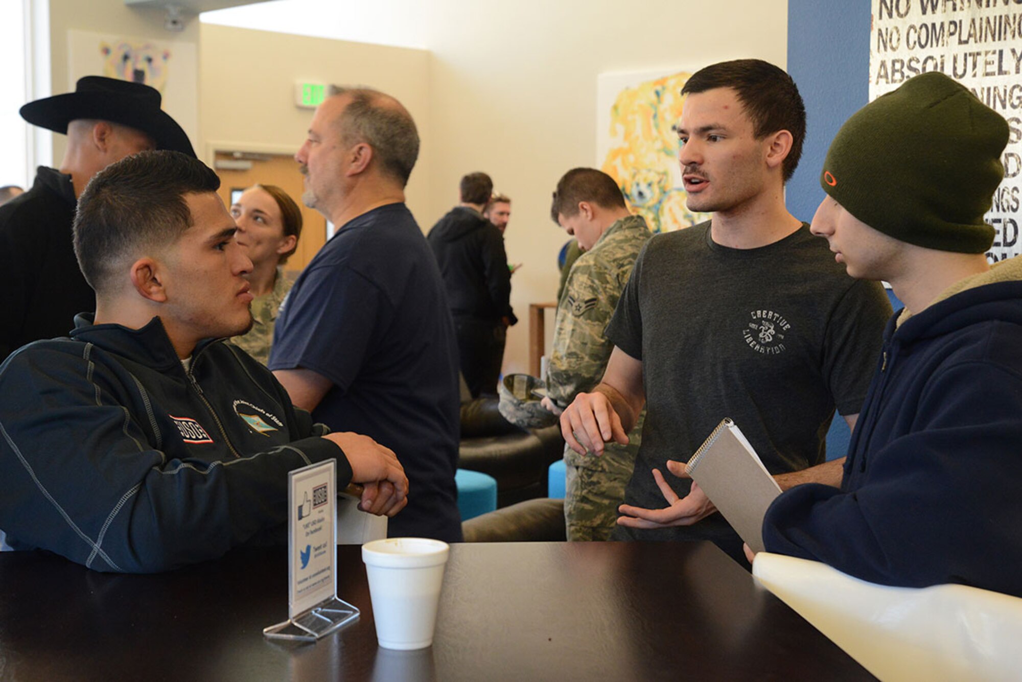 Ultimate Fighting Championship fighter Anthony Pettis talks to fans at the Joint Base Elmendorf-Richardson USO pancake breakfast as part of the USO Spring 2016 Entertainment Tour March 12, 2016. Air Force Gen. Paul Selva, 10th Vice Chairman of the Joint Chiefs of Staff, led the tour also featuring Miss America Betty Cantrell, country singer and 10-year Army veteran Craig Morgan, Carolina Panthers football player Charles Tillman, and Ultimate Fighting Championship fighter Donald ‘Cowboy’ Cerrone. (U.S. Air Force photo by Airman 1st Class Christopher R. Morales)