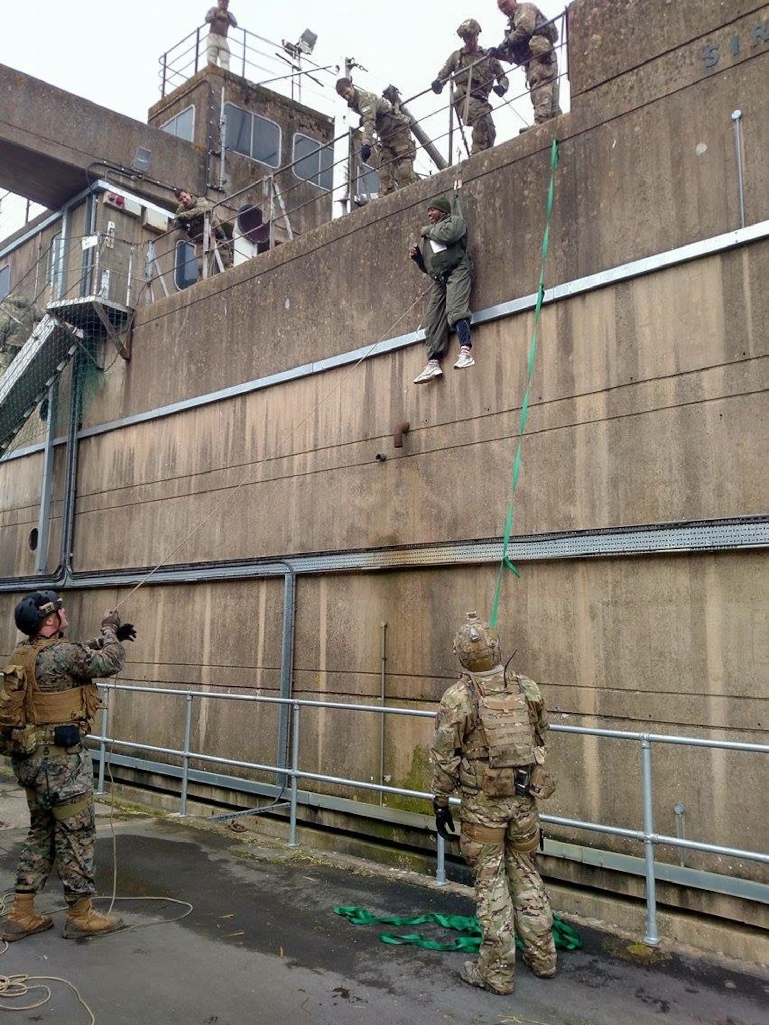 Airmen of the 57th Rescue Squadron hoist mock patients down a wall during training at the U.K. Fire Service College in Moreton-in-Marsh, England. Pararescuemen, also known as PJs, make up an elite team responsible for combat search and rescue missions. (Courtesy photo)