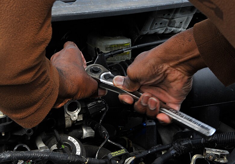 Herbert Doyle, Landstuhl Regional Medical Center lodging laborer, removes a car part at the Ramstein Automotive Recycling Center March 1, 2016, at Ramstein Air Base, Germany. The 86th Force Support Squadron Ramstein Automotive Recycling Center, located outside of the east gate, offers their services to ID card holders and North American Trade Organization members which include salvaging car parts, disposing cars and towing services. (U.S. Air Force photo/Airman 1st Class Larissa Greatwood)