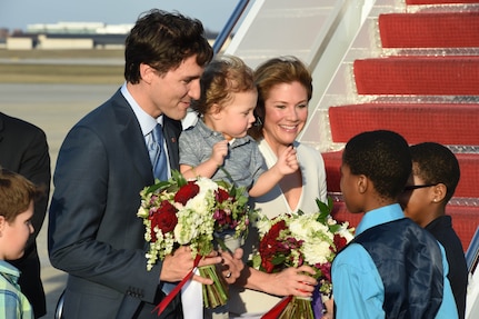 Canadian Prime Minister Justin Trudeau and first lady Sophie Gregoire-Trudeau are greeted with flowers by Jalique Wiseman and Aniya Walker, WB Patterson Elementary School students, at Joint Base Andrews, Md., March 11, 2016. Trudeau arrives for his first U.S. state visit as the Prime Minister of Canada. (U.S. Air Force photo by Senior Airman Joshua R. M. Dewberry/RELEASED)