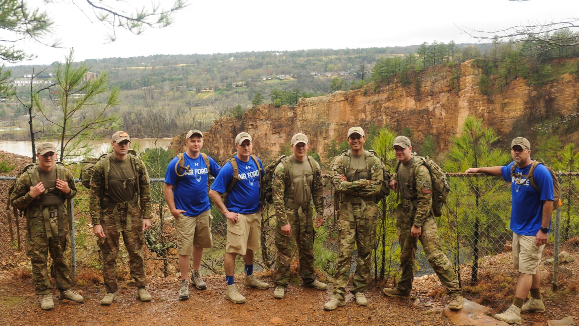 Members of the 19th Logistics Readiness Squadron pose for a photo during an 18-mile ruck march, March 11, 2016 at Burns Park in North Little Rock, Ark. The 19th LRS team was training for the upcoming Bataan Memorial Death March at White Sands Missile Range, N.M., which serves as a reminder to today’s generation of the harsh conditions the World War II veterans were forced to endure during their 60-mile march to a prisoner of war camp in the Philippines. (U.S. Air Force photo/Senior Airman Harry Brexel) 