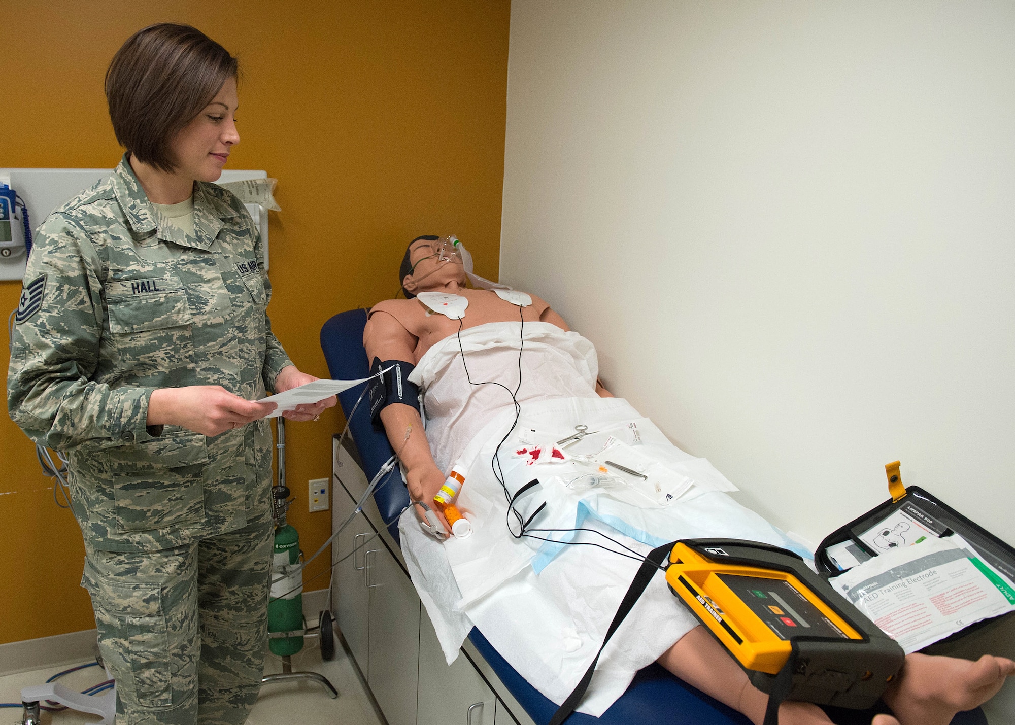 Tech. Sgt. LaShawn Hall, 66th Medical Squadron technician, participates in a patient safety awareness assessment at the clinic March 15. Clinic officials set up a ‘You Spot the Hazard’ exercise for medical technicians to identify potential hazards as part of a Patient Safety Awareness Week event. (U.S. Air Force photo by Jerry Saslav)