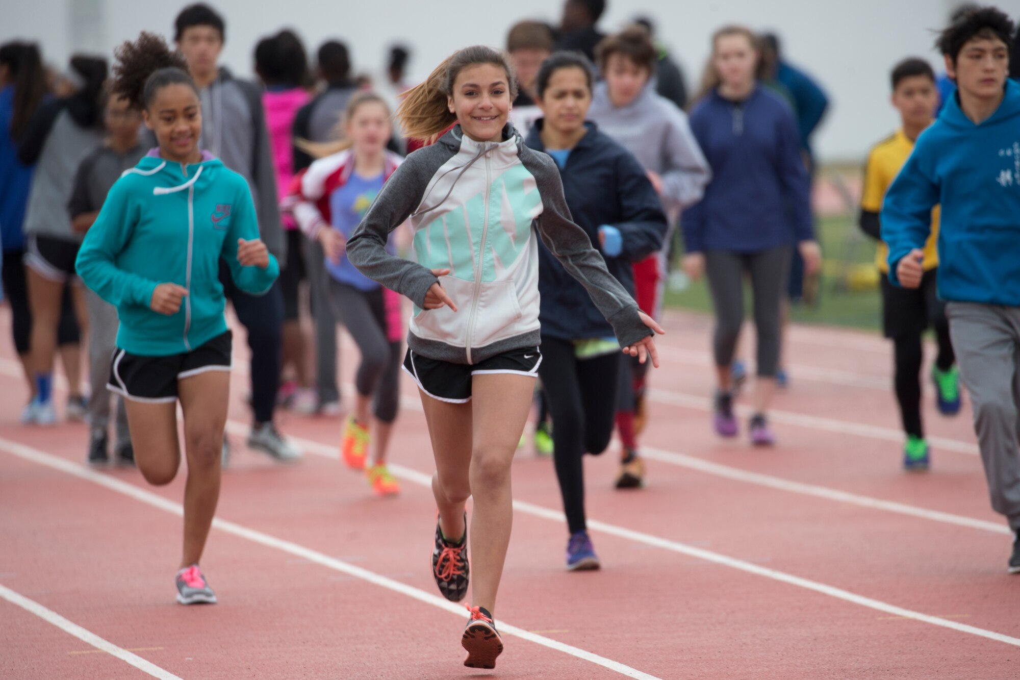 Participants from the Yokota Middle School and High School run on track during two-day World Records Camp at Yokota Air Base, Japan, March 12, 2016. Five Olympians visited Yokota to teach track and field skills, drills and techniques to over 70 junior athletes. (U.S. Air Force photo by Osakabe Yasuo/Released) 
