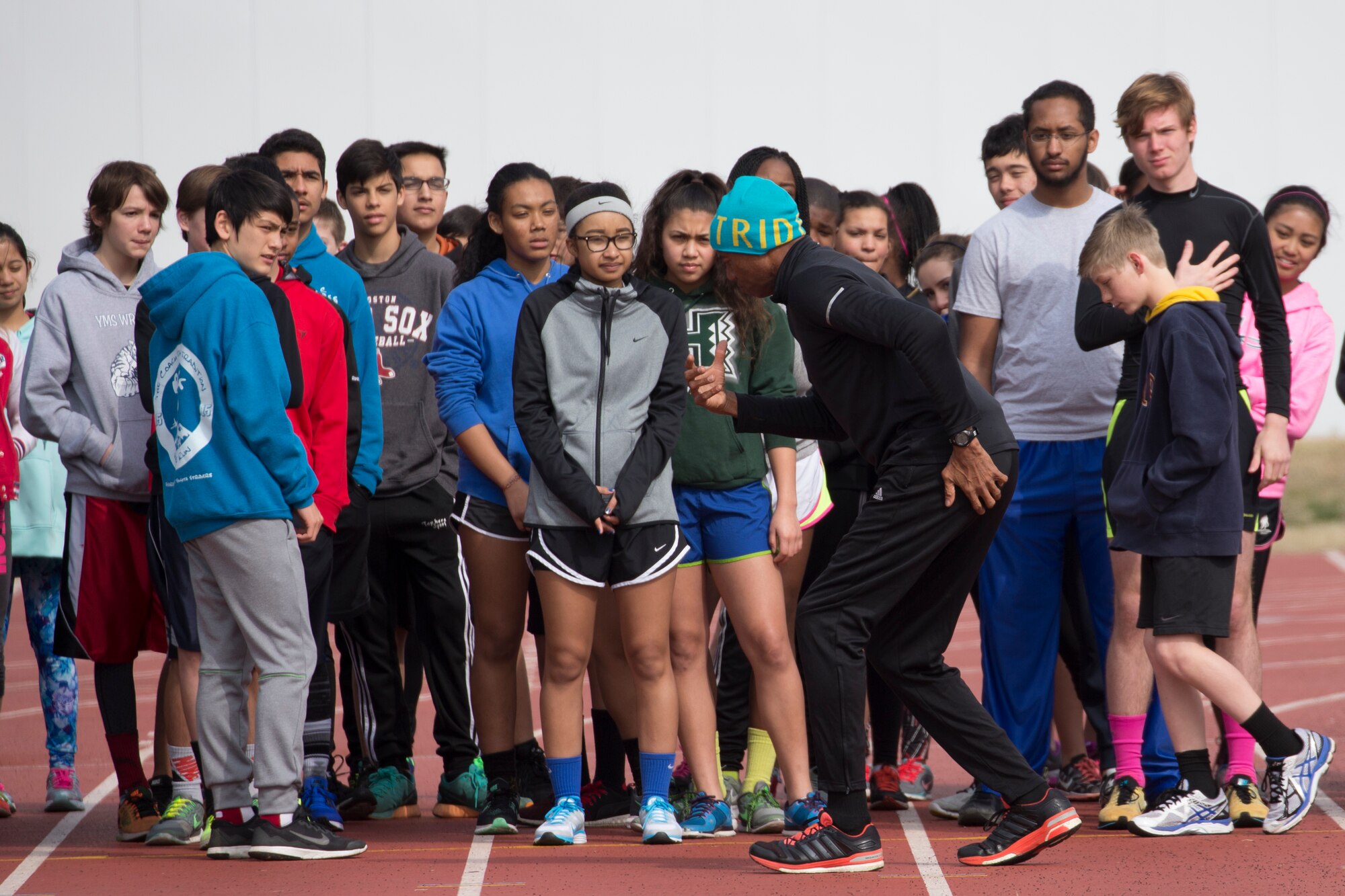 Participants from the Yokota Middle School and High School learn running techniques from Mike Powell, former Olympic participant, during the World Records Camp at Yokota Air Base, Japan, March 12, 2016. Four track and field gold medalists visited Yokota to coach track and field events. Over 70 students participated in two-day camp. (U.S. Air Force photo by Osakabe Yasuo/Released)