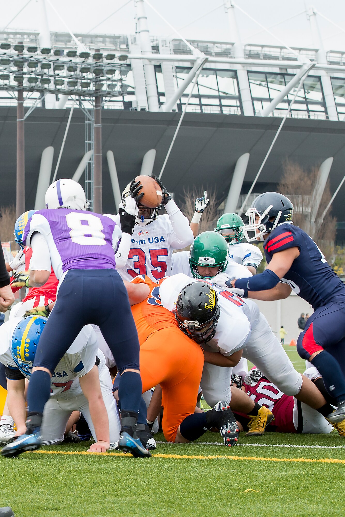 Jaylin Barmer, running back from Humphreys High School, leaps across the goalline for a touchdown during Tomodachi Bowl 2016 at Amino Vital Stadium, Tokyo, Japan, March 13, 2016. Team USA won the game with a final score of 26-6. (U.S. Air Force photo by Senior Airman David C. Danford/Released)