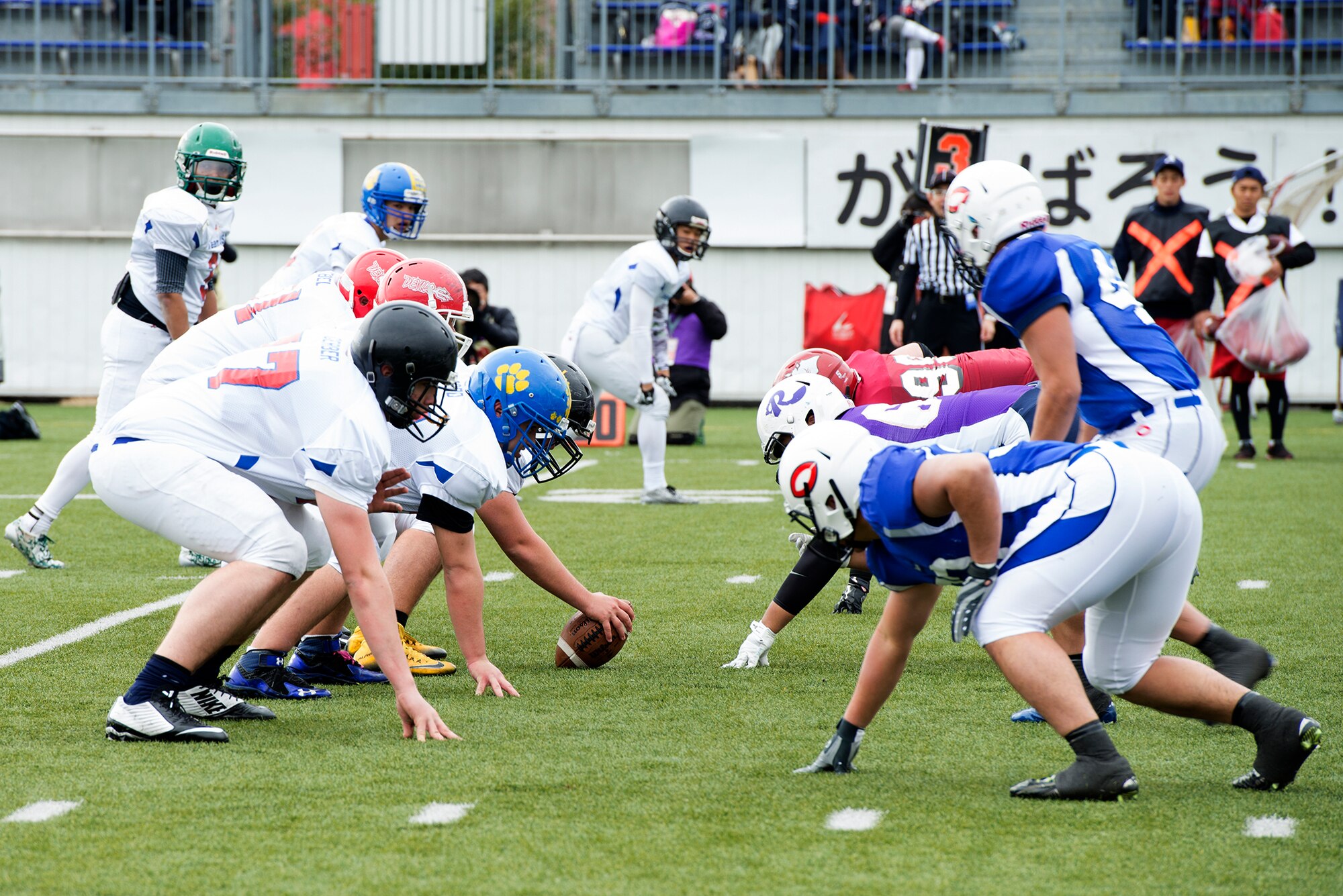 Team USA and Rising Sun face-off at the line of scrimmage during Tomodachi Bowl 2016 at Amino Vital Stadium, Tokyo, Japan, March 13, 2016. Team USA is made up of high school students from 10 Department of Defense Education Activity schools from across the Indo-Asia Pacific Region. (U.S. Air Force photo by Senior Airman David C. Danford/Released)