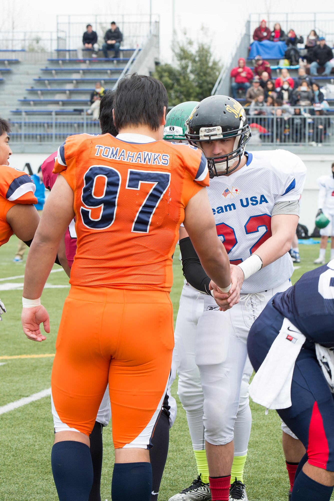 Captains from Teams USA and Rising Sun shake hands before Tomodachi Bowl 2016 at Amino Vital Stadium, Tokyo, Japan, March 13, 2016. Tomodachi, Japanese for friend, is also the name used for the disaster relief operation following the Tohoku Earthquake and Tsunami in 2011. (U.S. Air Force photo by Senior Airman David C. Danford/Released)