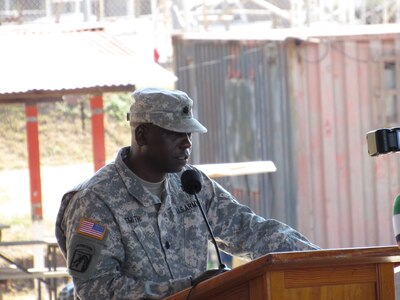 Lt. Col. Marshall Smith, Joint Task Force-Bravo Medical Element commander, gives a speech during a change of responsibility ceremony between the 94th and 325th Combat Support Hospital units at Soto Cano Air Base, Honduras, and March 8, 2016. The ceremony included a brief history of both units and their distinguished events, such as their support during operation Iraqi Freedom. (U.S. Army photo by Capt. Faith Coffey/Released)