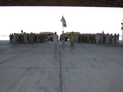Soldiers from the 325th and 94th Combat Support Hospitals stand in formation during a change of responsibility ceremony for the Joint Task Force-Bravo Medical Element March 8, 2016 at Soto Cano Air Base, Honduras. The 325th, from Independence, Missouri, deployed to Honduras on February 2016, replacing the outbound personnel from the 94th, whose home station is located in Seagoville, Texas (U.S. Army photo illustration by Capt. Faith Coffey/Released)