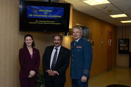 Mr. Jamshed Merchant (center), Consul General for Canada in the upper Midwest; Royal Canadian Air Force Col. Kevin F. Bryski (right), USSTRATCOM Canadian liaison officer; and Ms. Dani Fisher, public affairs officer with the Canadian Consulate in Minneapolis, Minn., pose for a photo during Merchantâ€™s visit to USSTRATCOM Headquarters, Offutt Air Force Base, Neb., March 16, 2016. While here, Merchant held discussions with senior leaders and subject matter experts from the command to learn about USSTRATCOMâ€™s global strategic missions. Hosting Merchantâ€™s visit to USSTRATCOM Headquarters supports the commandâ€™s ongoing effort to build, sustain and support partnerships with ally nations and was also part of his trip across Nebraska in recognition of "Canada Week" in the state. One of nine DoD unified combatant commands, USSTRATCOM has global strategic missions, assigned through the Unified Command Plan, which include strategic deterrence; space operations; cyberspace operations; joint electronic warfare; global strike; missile defense; intelligence, surveillance and reconnaissance; combating weapons of mass destruction; and analysis and targeting. (USSTRATCOM photo by U.S. Air Force Staff Sgt. Jonathan Lovelady)