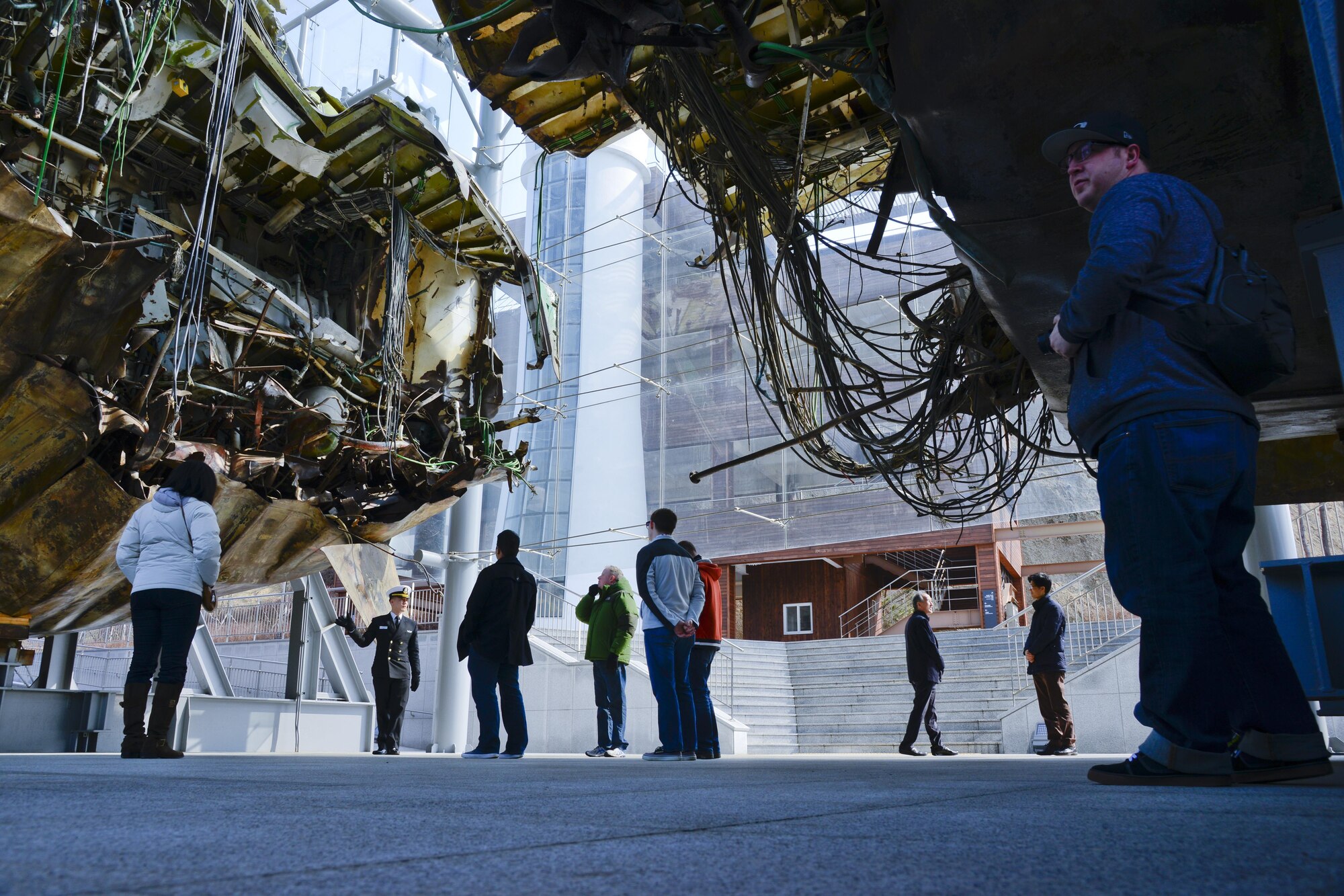 U.S. Airmen from 51st Fighter Wing public affairs stand under the ship Cheonan at the ROK Navy 2nd Fleet Command in Pyeongtaek-si, Gyeonggi-do Province on Feb. 26, 2016. The ship was attacked by a North Korean submarine at 9:22 p.m. on March 26, 2010, killing 46 ROK Sailors. It is one of many recent attacks on South Korea from North Korea patrols. (U.S. Air Force photo by Senior Airman Kristin High/Released)