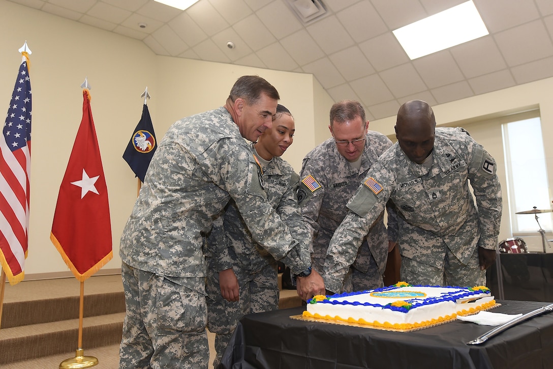 From left to right: Maj. Gen. Jeffrey N. Colt, commanding general, First Army Division West; 2nd Lt. Natasha Hernandez, 2nd Battalion, 381st Regiment, 479th Field Artillery Brigade; Brig. Gen. Frederick R. Maiocco, Jr. commanding general, 85th Support Command and deputy commanding general, First Army Division West; and Sgt. 1st Class Lawrence Michaels, 2nd Battalion, 381st Regiment, 479th Field Artillery Brigade; cut an Army Reserve birthday cake following a 107th birthday celebration of the Army Reserve at the North Fort Hood Chapel, May 2. The official birth date of the Army Reserve is April 23, 1908. (U.S. Army photo by Sgt. 1st Class Anthony L. Taylor/Released)