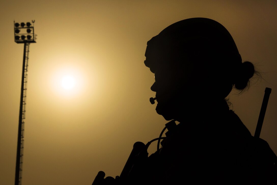 Air Force Senior Airman Bre Balk provides security as a C-130J Super Hercules aircraft is unloaded on Camp Shorabak, Afghanistan, March 16, 2016. Air Force photo by Tech. Sgt. Robert Cloys