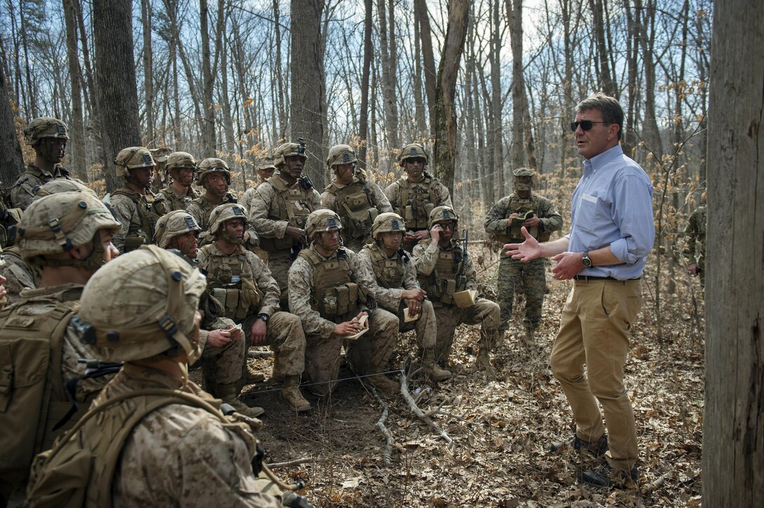 Marines at The Basic School participating in a a platoon in defense demonstration at Marine Corps Base Quantico, Va., take a break from training in order to speak with Secretary of Defense Ash Carter as he visits the base to observe Marine Corps training and speak with Marines March 9, 2016.  (DoD photo by Senior Master Sgt. Adrian Cadiz)(Released)