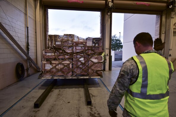 Staff Sgt. Mark Scott, engineering support NCO in-charge with the 1st Special Operations Civil Engineer Squadron, guides a forklift onto a scale at Hurlburt Field, Fla., March 14, 2016. Air Commandos participated in a mobility exercise to showcase their ability to deploy at a moment’s notice ‘Any Time, Any Place.’ (U.S. Air Force photo by Senior Airman Jeff Parkinson)