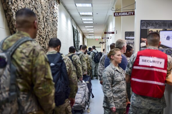 Airmen of the 1st Special Operations Wing process through the deployment line at the Deployment Control Center, Hurlburt Field, Fla., March 14, 2016. Air Commandos participated in a mobility exercise to showcase their ability to deploy at a moment’s notice ‘Any Time, Any Place.’ (U.S. Air Force photo by Senior Airman Jeff Parkinson)