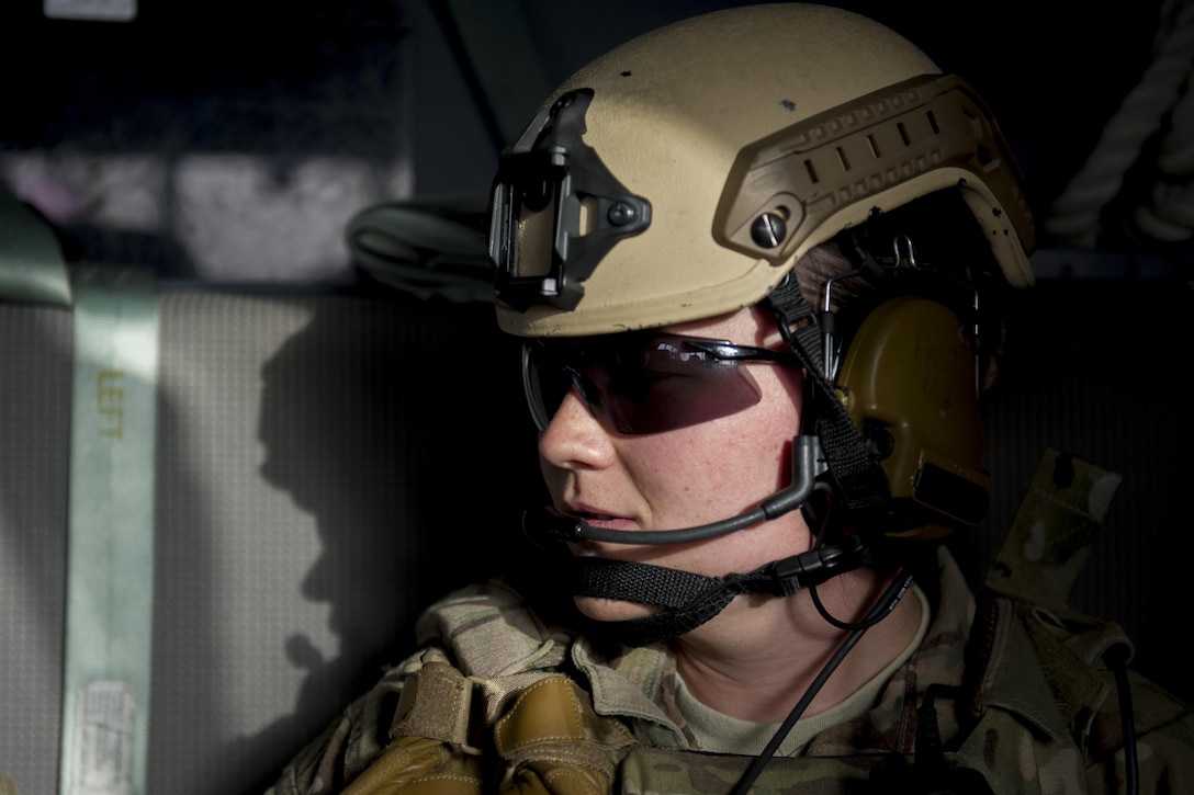 Air Force Senior Airman Bre Balk sits in the cockpit of a C-130J Super Hercules aircraft en route to Camp Shorabak, Afghanistan, March 16, 2016. Air Force photo by Tech. Sgt. Robert Cloys