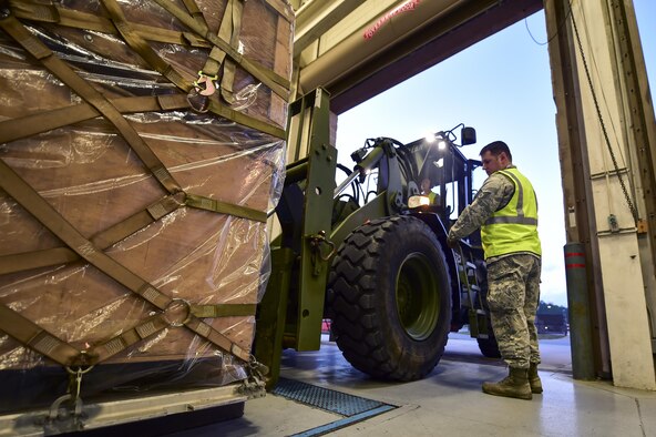 Staff Sgt. Mark Scott, engineering support NCO in-charge with the 1st Special Operations Civil Engineer Squadron, directs a forklift at Hurlburt Field, Fla., March 14, 2016. Air Commandos participated in a mobility exercise to showcase their ability to deploy at a moment’s notice ‘Any Time, Any Place.’ (U.S. Air Force photo by Senior Airman Jeff Parkinson)