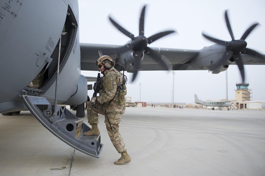 Air Force Senior Airman Bre Balk returns to a C-130J Super Hercules aircraft after providing security on Camp Shorabak, Afghanistan, March 16, 2016. Air Force photo by Tech. Sgt. Robert Cloys