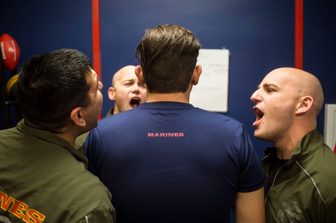 Sgt Ruben Arzate (left), a recruiter with Recruiting Sub-station Casper,
Gunnery Sgt. Michael Sterba (middle), the staff noncommissioned officer in
charge  for RSS Casper, and Sgt. Cody Wallace, a recruiter with RSS Casper,
motivate Tanner Souder, a poolee, during a pool function in Casper, WY March
12, 2016. The event, which lasted over the morning, consisted of an Initial
Strength Test, ammo can lifts and a game of ultimate Frisbee.
