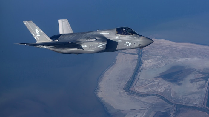 An F-35B Lightning II with Marine Fighter Attack Squadron 121 “Green Knights” flies alongside a KC-130J Super Hercules with Marine Aerial Refueler Transport Squadron 352 over Southern California, March 8, 2016. The two F-35Bs completed additional training after successfully conducting an aerial refuel with VMGR-352.