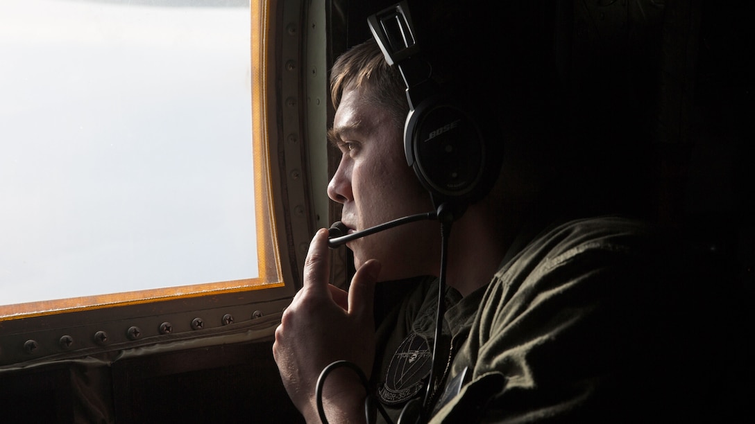 Cpl. Cody Holder, a crew master with Marine Aerial Refueler Transport Squadron 352 and an Easton, Pa. native, observes an F-35B Lightning II during an aerial refueling mission over Southern California, March 8, 2016. Marines with VMGR-352 supported an aerial refueling mission with two F-35Bs from Marine Fighter Attack Squadron 121.