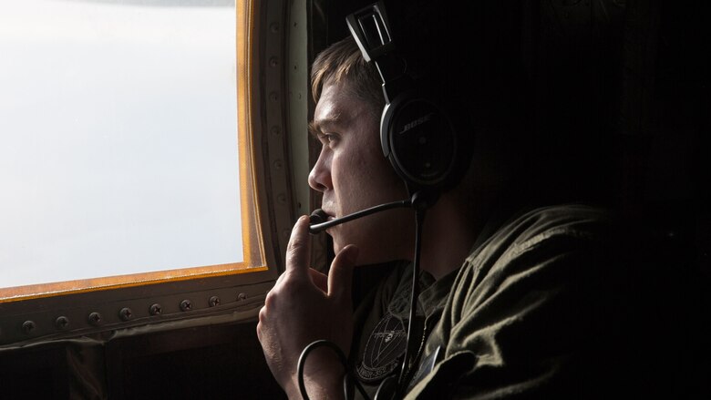 Cpl. Cody Holder, a crew master with Marine Aerial Refueler Transport Squadron 352 and an Easton, Pa. native, observes an F-35B Lightning II during an aerial refueling mission over Southern California, March 8, 2016. Marines with VMGR-352 supported an aerial refueling mission with two F-35Bs from Marine Fighter Attack Squadron 121.