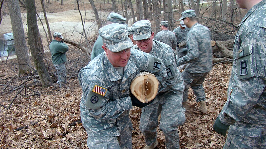 Army Reserve Soldiers from 1st Battalion, 383rd Training Support Battalion, 166th Aviation Brigade, First Army Division West – based at Fort Des Moines- work together with the City of Des Moines Parks and Recreation Department to remove logs and brush from Greenwood Park in Des Moines, Iowa, on April 5. This was the first step in allowing the park to return to a more natural state after a rough winter there. Following the cleanup project, the soldiers returned to their reserve center where they hosted their 106th birthday celebration of the Army Reserve with Mayor Pro Tem T.H. Bob Mahaffey, 14-year Air Force Reserve veteran. (Photo by Capt. Mark Butcher)
