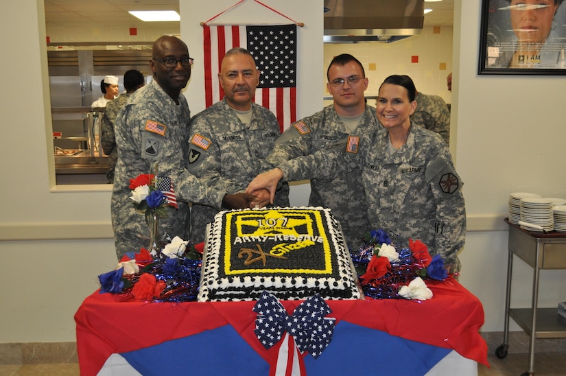 Reserve Soldiers celebrate the 107th birthday of the Reserve April 23 at the Maj. Chester Garret Dining Facility on McGregor Range, N.M. From Left to right: Lt. Col. Bradford M. Shaw, commander of 2206th Mobilization Support Battalion, Master Sgt. Lorenzo Sifuentes, special projects noncommissioned officer in charge, Spc. Brandon Lievense, chaplain’s assistant, Command Sgt. Maj. Jane P. Baldwin, command sergeant major, 2206th MSB, during the ceremonial cutting of the cake.