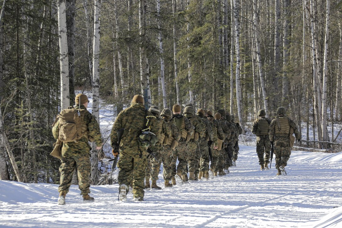 Marines depart from the Baumeister City urban operations training complex on Joint Base Elmendorf-Richardson, Alaska, March 6, 2016, after completing their training. Air Force photo by Alejandro Pena