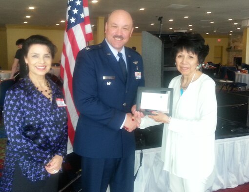 Col. W. Javier Nieves, the 10th Medical Group's chief of aerospace medicine at the U.S. Air Force Academy, receives a certificate of appreciation from Anna Marie Ortiz (left) and Carmen Abeyta, March 9, 2016. Ortiz and Abeyta organized the Latino Community Luncheon in Colorado Springs that day, which featured Neives as guest speaker. (U.S. Air Force photo/Melissa Porter)
