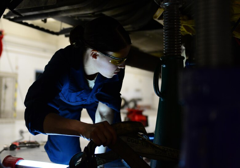 U.S. Air Force Staff Sgt. Vanessa Hoppough, a 354th Logistics Readiness Squadron special vehicle maintenance journeyman, works under a fuel truck March 2, 2016, at Eielson Air Force Base, Alaska. Hoppough and a team of Airmen worked to replace seals and O-rings on the transmission and return it to its service. (U.S. Air Force photo by Airman 1st Class Cassandra Whitman/Released)