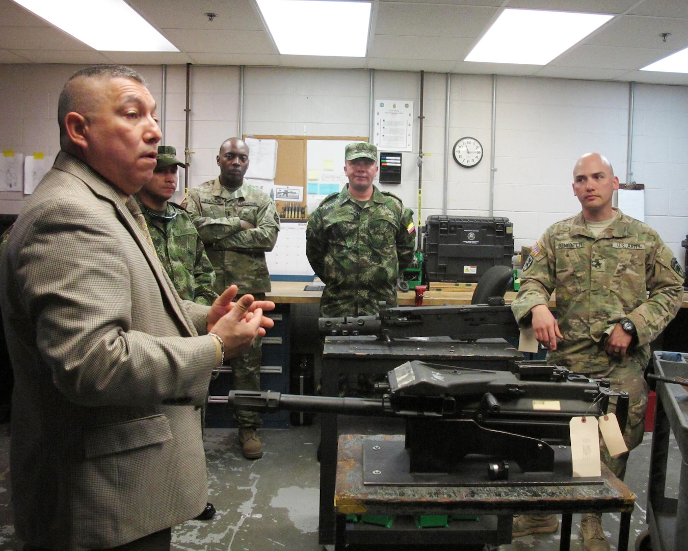 Jose Terrones from U.S. Army South translates maintenance procedures into Spanish during a Subject Matter Expert Exchange at the Combined Support Maintenance Shop at McEntire Joint National Guard Base, Eastover, South Carolina, March 8, 2016. Maintenance officers from the Colombian army toured South Carolina Army National Guard maintenance facilities during a State Partnership Program Subject Matter Expert Exchange held March 7-11, 2016. 