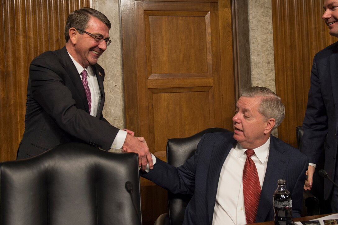 Defense Secretary Ash Carter, left, shakes hands with U.S. Sen. Lindsey Graham of South Carolina before a Senate Armed Services Committee hearing in Washington, D.C., March 17, 2016. DoD photo by Air Force Senior Master Sgt. Adrian Cadiz