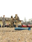 Airman 1st Class Victoria Hammond, 2nd Civil Engineer Squadron emergency manager, evaluates Airmen during chemical, biological, radiological and nuclear defense survival skills training at Barksdale Air Force Base, La., March 8, 2016. The Airmen learn how to identify unexploded ordnances, how to care for and use protective gear and how to respond in the event of a CBRN attack. (U.S. Air Force photo/Senior Airman Amanda Morris)