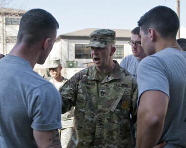 Master Sgt. Keith Buchanan, with the 316th Sustainment Command (Expeditionary), instructs competitors what to unpack for their layout formation for the 316th ESC Best Warrior Competition at Fort Knox, Ky., March 15, 2016. (U.S. Army photo by Staff Sgt. Dalton Smith/Released)