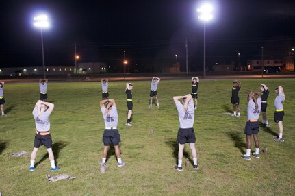 U.S. Army Reserve Soldiers, competing in the 316th Sustainment Command (Expeditionary) Best Warrior Competition, stretch prior to the Army Physical Fitness Test at Fort Knox, Ky., March 16, 2016. (U.S. Army photo by Staff Sgt. Dalton Smith/Released)