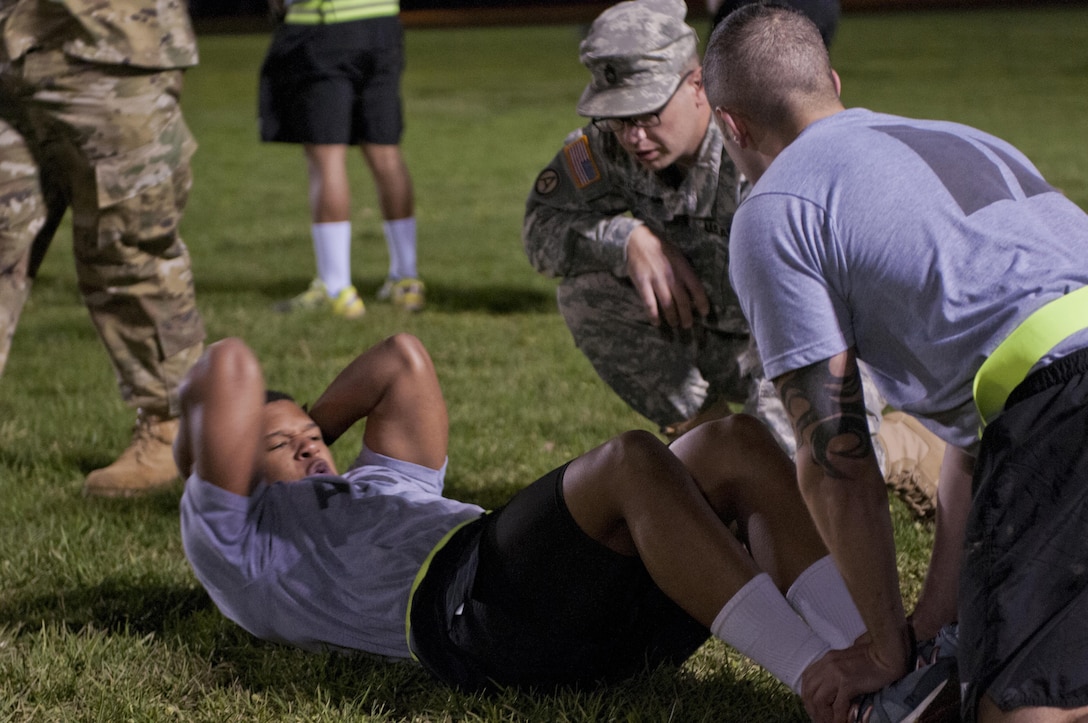 A U.S. Army Reserve Soldier, competing in the 316th Sustainment Command (Expeditionary) Best Warrior Competition, performs a situp during the Army Physical Fitness Test at Fort Knox, Ky., March 16, 2016. (U.S. Army photo by Staff Sgt. Dalton Smith/Released)