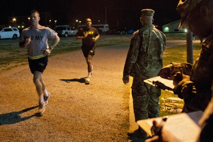 U.S. Army Reserve Soldiers, competing in the 316th Sustainment Command (Expeditionary) Best Warrior Competition, complete the first mile of the two mile run portion of the Army Physical Fitness Test at Fort Knox, Ky., March 16, 2016. (U.S. Army photo by Staff Sgt. Dalton Smith/Released)