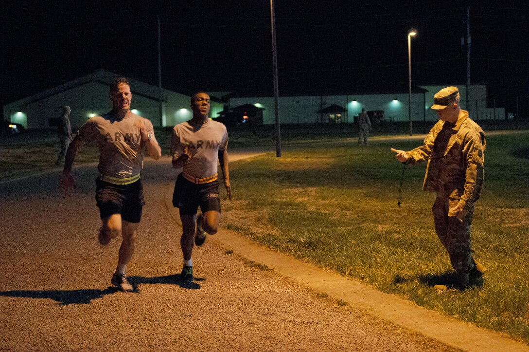 U.S. Army Reserve Soldiers, competing in the 316th Sustainment Command (Expeditionary) Best Warrior Competition, push themselves to compete the two mile run portion of the Army Physical Fitness Test at Fort Knox, Ky., March 16, 2016. (U.S. Army photo by Staff Sgt. Dalton Smith/Released)