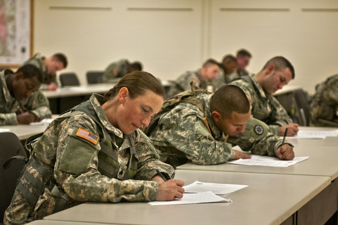 Sgt. Erin Bridges, with the 976th Transportation Detachment, completes the essay portion of the 316th Sustainment Command (Expeditionary) Best Warrior Competition at Fort Knox, Ky., March 16, 2016. (U.S. Army photo by Staff Sgt. Dalton Smith/Released)