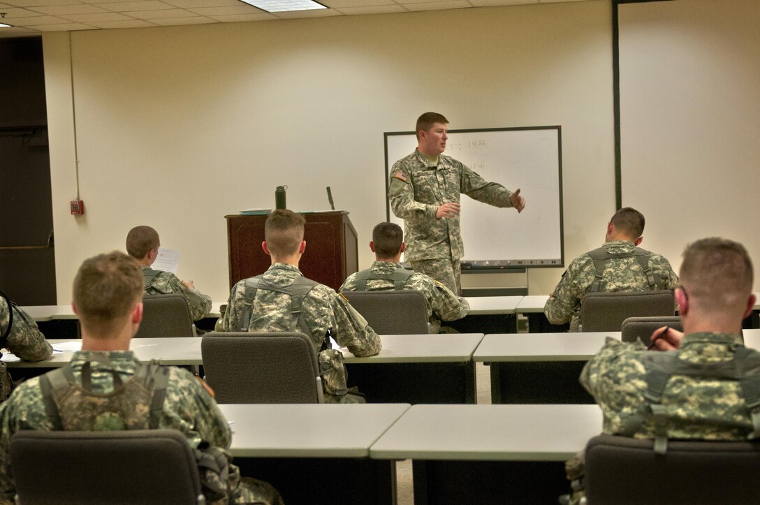 Sgt. Adam McGinnis, with the 316th Sustainment Command (Expeditionary), instructs competitors how the conduct the essay and exam portion of the 316th Sustainment Command (Expeditionary) Best Warrior Competition at Fort Knox, Ky., March 16, 2016. (U.S. Army photo by Staff Sgt. Dalton Smith/Released)